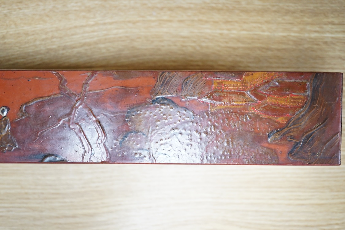 A Chinese red lacquered stand, 39cm wide
